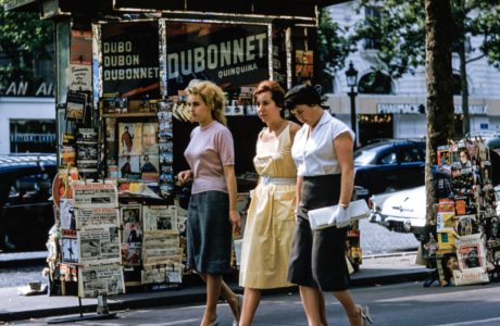 3 Women walking in front of a kiosk by Les Anderson on Unsplash