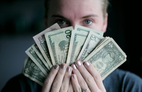 Young woman holding money